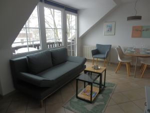 Wohnzimmer mit Schlafcouch Bild 31: Fewo bis 4 Personen - mit kostenlosem Schwimmbad in Timmendorfer Strand