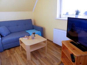 Sitzecke mit Fernseher oben im SchlafzimmerI